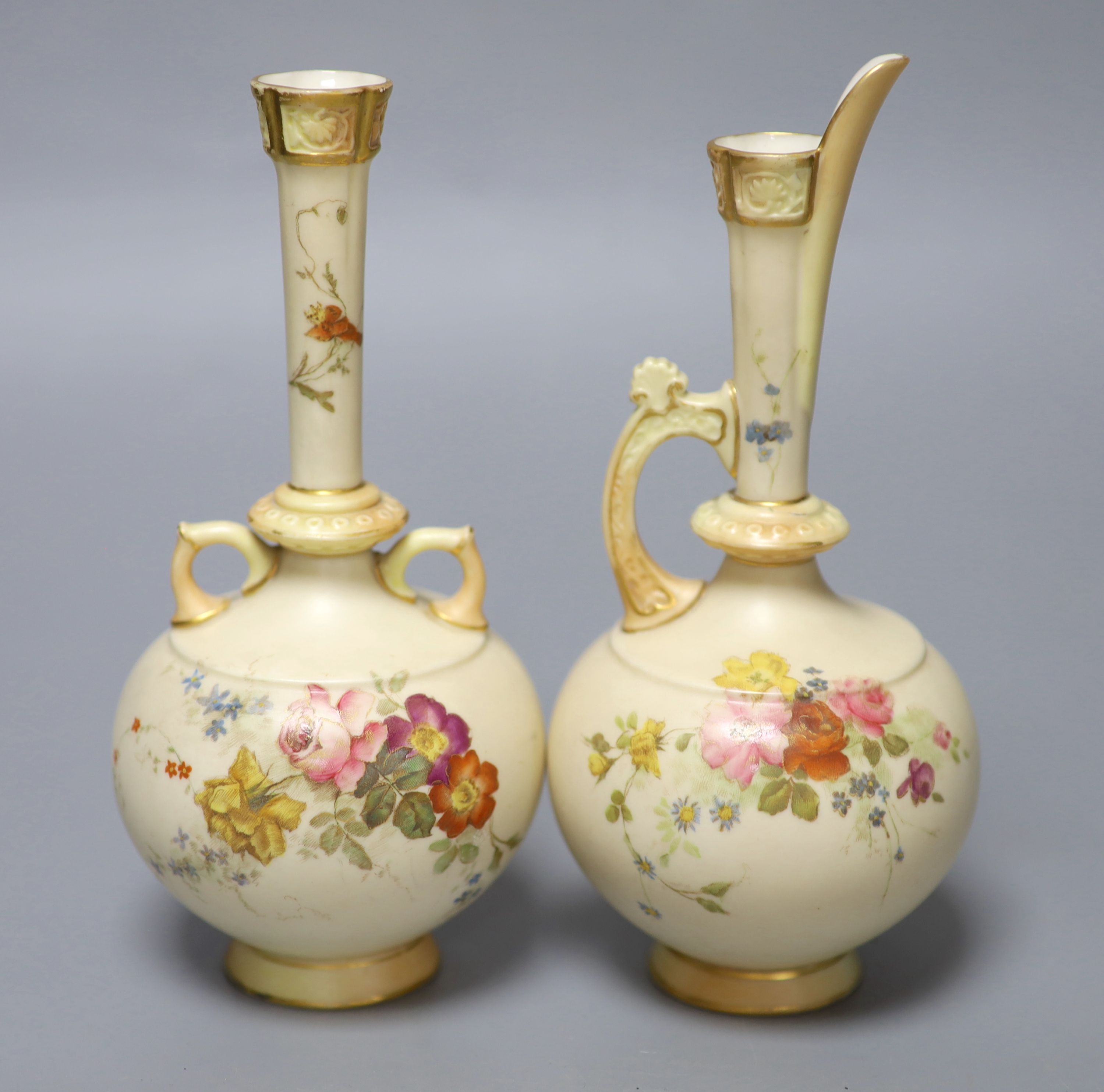 A Royal Worcester blue ivory two handled vase painted and gilded with flowers and a similar ewer, green marks, both date codes 1893, 19